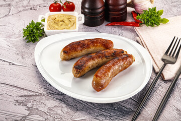 Delicous natural roasted sausages in the plate