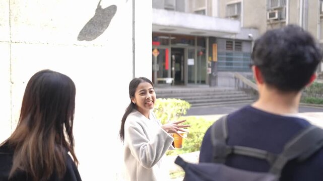 Taiwanese man and woman in their 20s and a South Asian woman walking together and chatting amicably on a university campus in Da&rsquo;an District, Taipei City, Taiwan.&nbsp;
