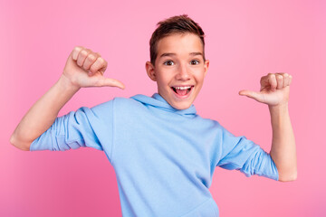 Photo portrait of funny teenager boy point self proud excited wear trendy blue outfit isolated on...