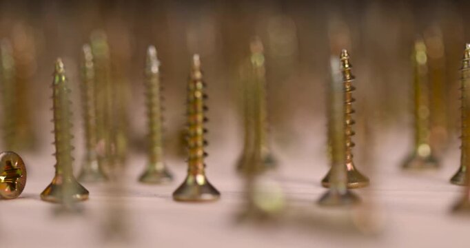 golden self-tapping screws for installation and construction work with wood, yellow metal self-tapping screws for fixing wooden boards and other wood products