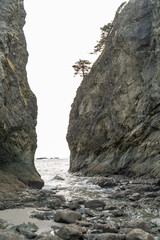 A beautiful view of giant rocks and ocean at Rialto Beach on a cloud day.