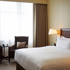 Fototapeta premium Relaxed Woman Enjoying Tranquil Hotel Room