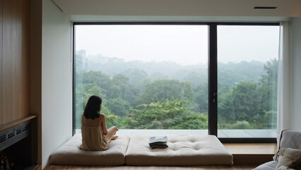 Relaxed Woman Enjoying Tranquil Hotel Room