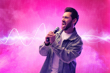 Handsome man with microphone singing on pink background. Audio waveform near him