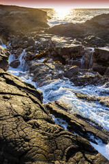 Sunset Over The Volcanic Shoreline at Hokulia Shoreline Park, Hawaii Island, Hawaii, USA