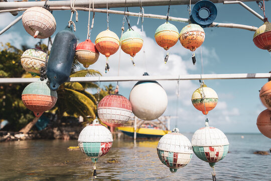 Sun faded boat buoy on the island of Bora Bora. The colorful round objects are used for fishing and protecting nautical ocean boats from damage. 