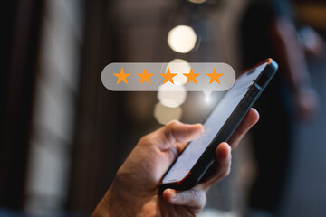 Star icon satisfaction survey, businessman finger to smartphone with five star icons, ranking of...