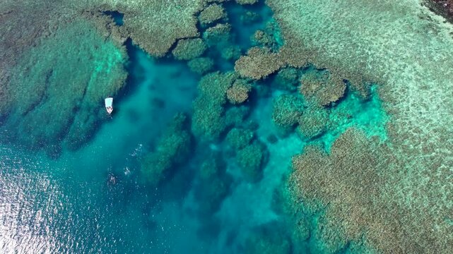 Aerial view above Scuba dive and snorkeling site coral reef beside tropical Island in Fiji