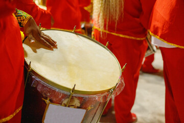 man playing tambourine at an event in Rio de Janeiro.