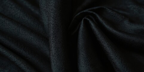Obraz premium A small dark black pattern on silk fabric creating a textured background with a unique combination of lines colors and shadows perfect for a copy space image
