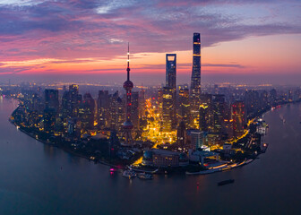 Naklejka premium Aerial view of modern city skyline and buildings at sunrise in Shanghai