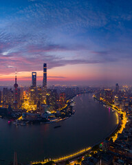 Fototapeta premium Aerial view of modern city skyline and buildings at sunrise in Shanghai