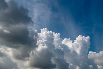 There are clouds in the blue sky