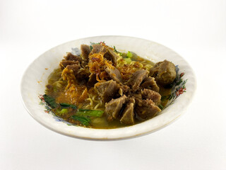 A steaming bowl of Bakso, a popular Indonesian dish featuring tender meatballs, egg noodles, and a flavorful broth, topped with crispy shallots. isolated on white background.