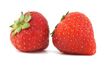 Close-up of two fresh strawberries isolated on white background