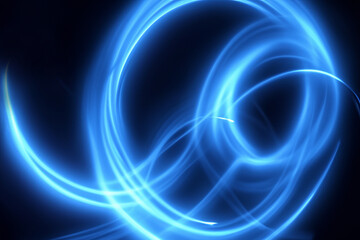 Fototapeta premium Abstract blue glowing light trails forming circular pattern on dark background for movement, motion and energy concept