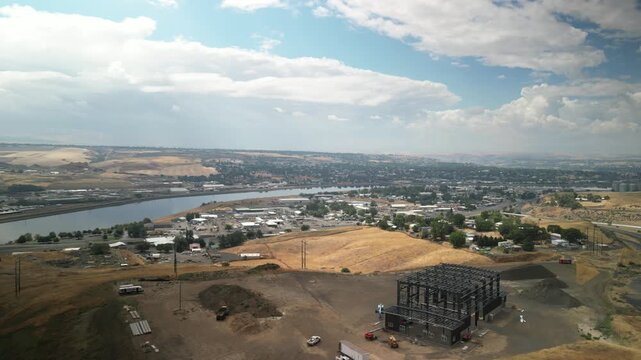 Wide aerial of Lewiston Idaho town with industrial plants along Clearwater River