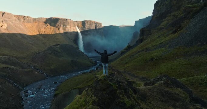 Man Appreciating The Scenic View Of Haifoss Waterfall