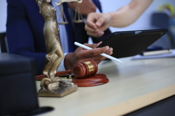 Asian male lawyer reading time limit law, giving advice, tax office, law firm, judge, legal advisor, lawyer working in office, judge knocking wood with lawyer for justice, contract