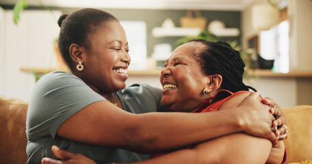 Obraz premium Black family, happy and women on sofa for hug, love and support in living room. Elderly mother, daughter and embrace at home for care, surprise visit and reunion on couch with excitement and trust