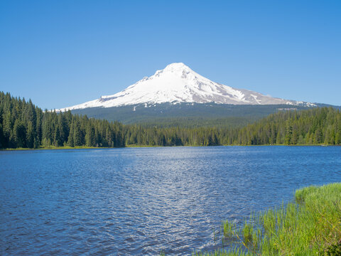A mountain is in the background and the water is calm