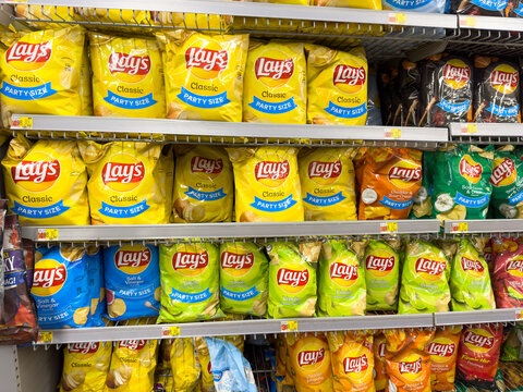 Variety of Lays potato chips on display inside an American supermarket.
