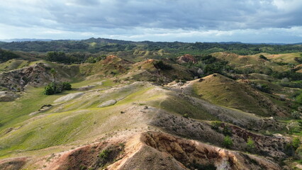 Fototapeta premium Aerial view, natural panorama of the savanna hills which are also known as Pajjongan hills in Bombana, Southeast Sulawesi