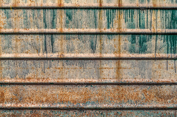 Old rusty metal sheet texture. Abstract wall grunge background. Oxidation on iron plate.