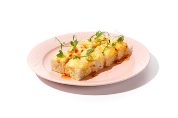 Delicious Baked Sushi Roll with Sesame, Cheese, and Sweet Chili Sauce on Pink Plate