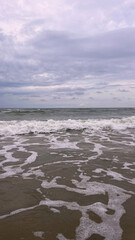 Seascape, stormy day on the Baltic Sea. Clouds meet the sea.