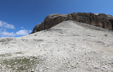 summit called Piz Boè with an Alpine Refuge called Capanna Fassa in the Dolomites in the Alps in northern Italy in summer