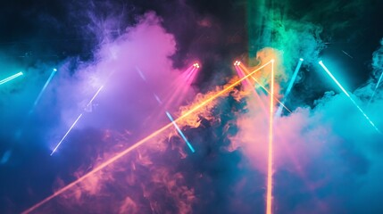 Fototapeta premium Vibrant and colorful laser beams shimmer through a veil of mist.