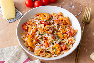 Farfalle pasta with shrimps, tomatoes and cheese. Healthy eating. Italian food.