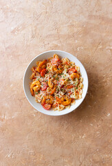 Farfalle pasta with shrimps, tomatoes and cheese. Healthy eating. Italian food.
