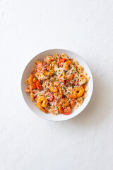 Farfalle pasta with shrimps, tomatoes and cheese. Healthy eating. Italian food.