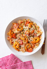 Farfalle pasta with shrimps, tomatoes and cheese. Healthy eating. Italian food.
