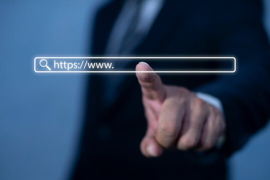 Businessman hand touching search bar with https://www. Businessman and internet concept. search engine optimization, web banner
