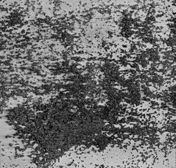 Monochrome backdrop of rusty surface dark gray hues. Black and white grunge rust metal texture. Close-up abstract background of aged old iron, scratch pattern, worn, distress area, corrosion details