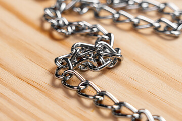 Shimmering metal chains perfectly entangled, highlighting their unique textures