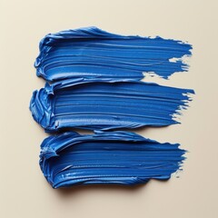 a realistic photography of blue lipstick stripes on light beige background. top view.
