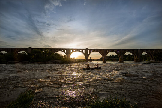 Couple canoeing on a river.