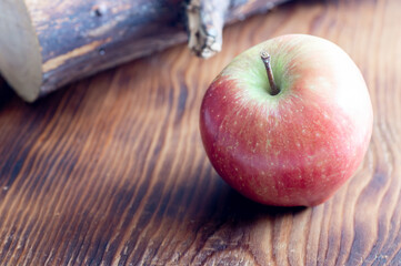red apple on wooden table
