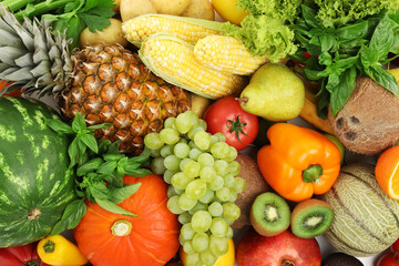 Different fresh fruits and vegetables as background, top view