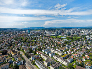Fototapeta premium Aerial view over Swiss City of Zürich north part with skyline and cityscape on a sunny summer morning. Photo taken August 6th, 2024, Zurich, Switzerland.