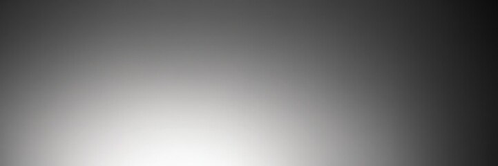 black and white gradient background with single light source, creating sense depth and movement.