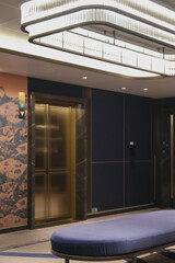 Staircase lobby will lifts elevators hallway and corridor inside modern cruiseship cruise ship liner in contemporary Art Deco interior design style