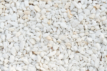 A close-up image of white gravel stones, ideal for backgrounds, textures, and construction-related...