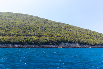 Fototapeta premium The peninsula Karaburun in Albania near the city of Vlore. A touristic hotspots for daytrips to swim in the crystal clear waters and it marks the border between the Adriatic and Ionian seas