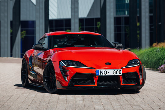 Toyota Supra GR A90 in the parking of a modern office center