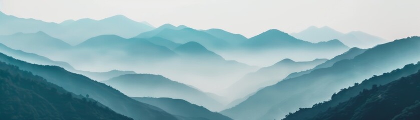 Fototapeta premium Serene mountain landscape with layers of misty blue hills and a calm atmosphere, perfect for nature and tranquility themes.